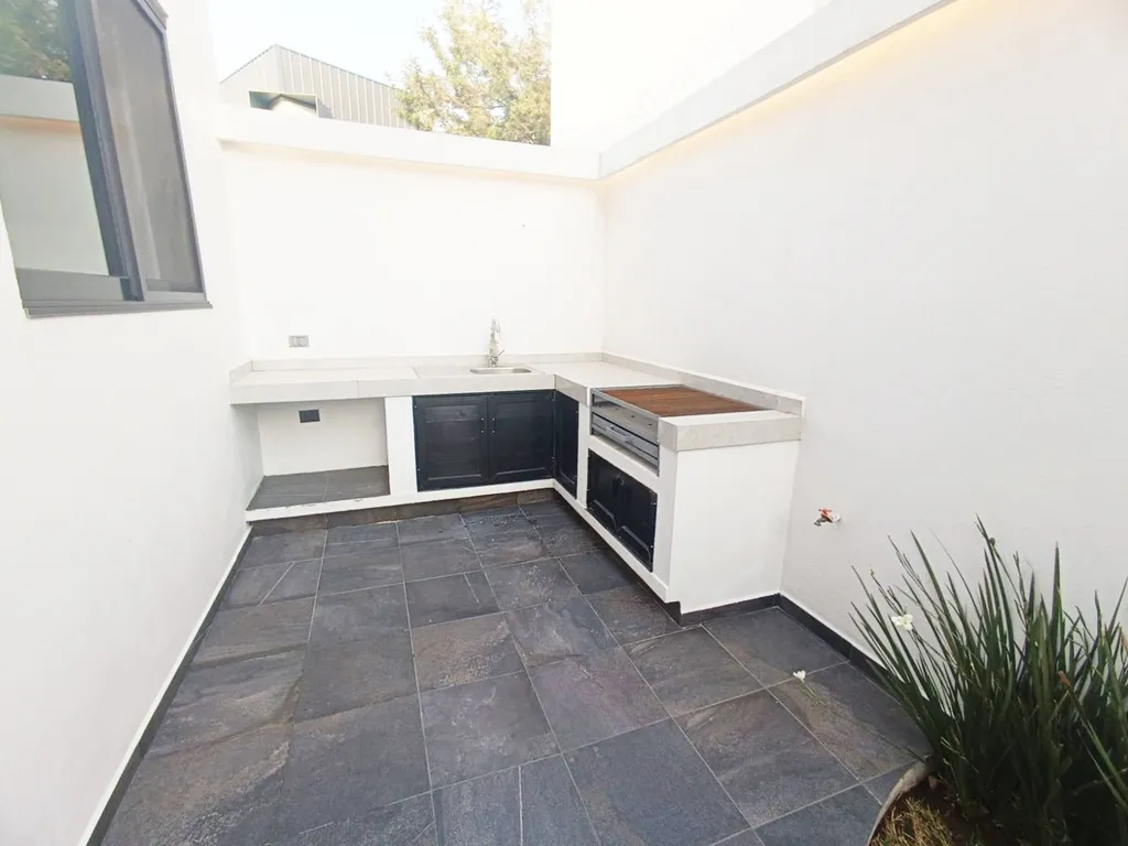 área de asador con barra y tarja