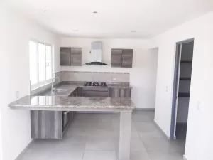 cocina integral con barra en granito