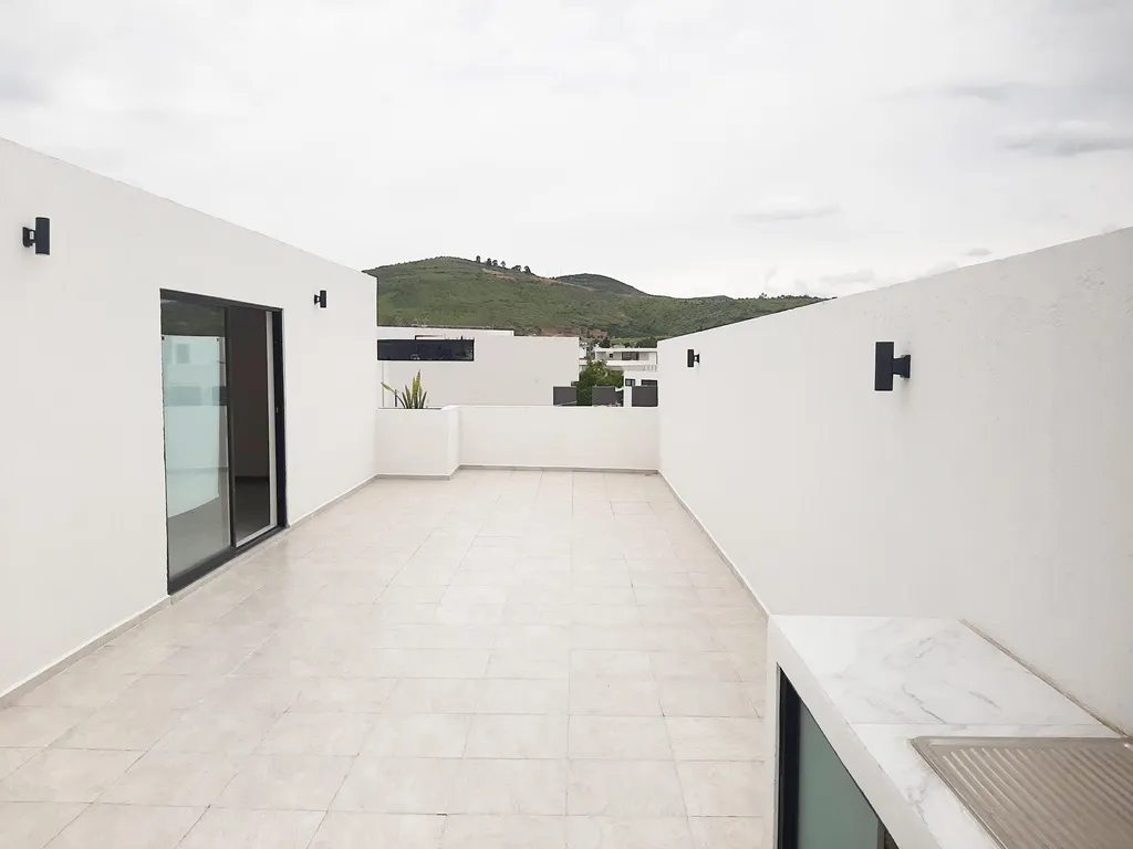 amplio roof garden con tarja y asador